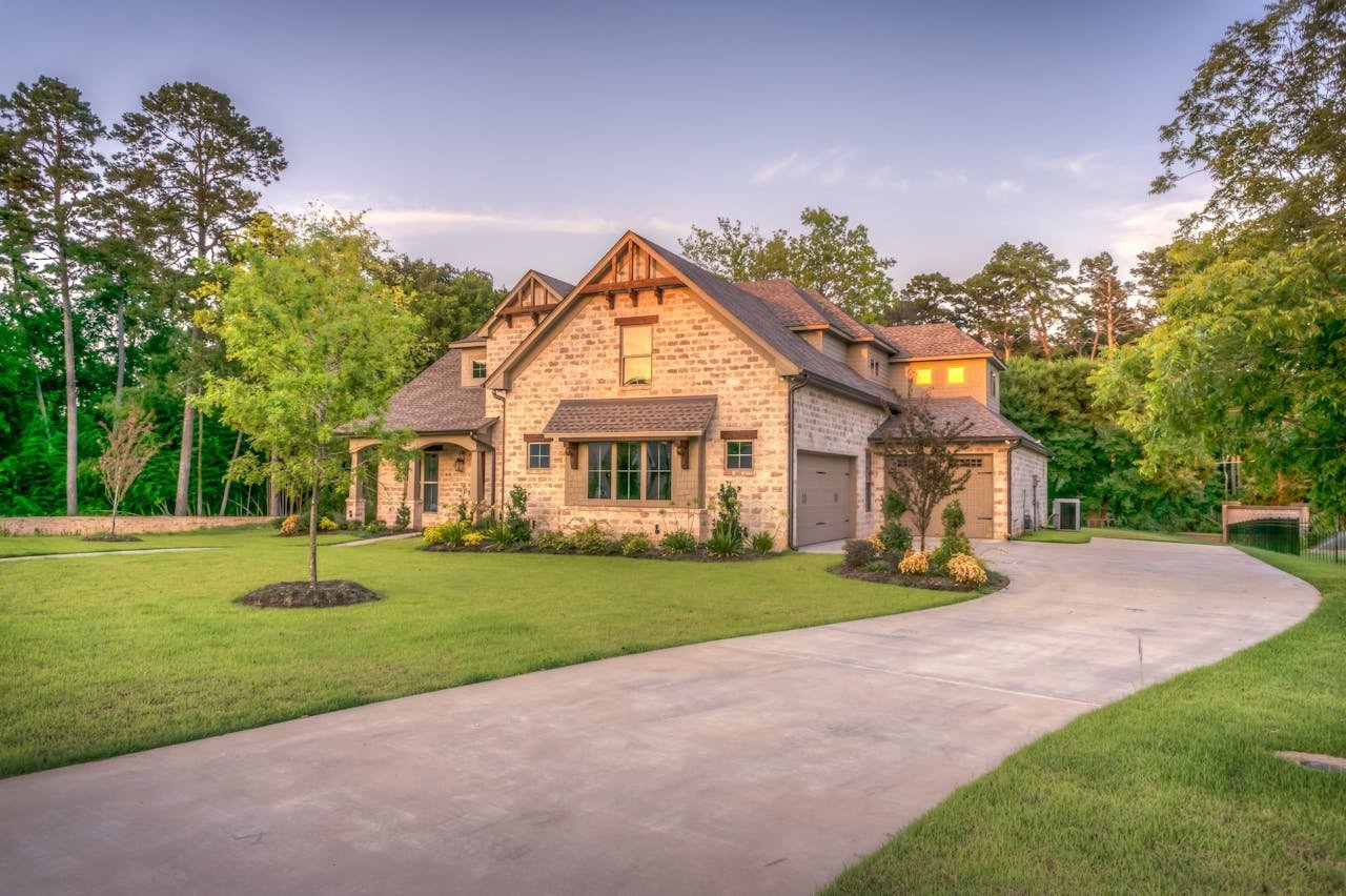 A residential bungalow surrounded by mature trees